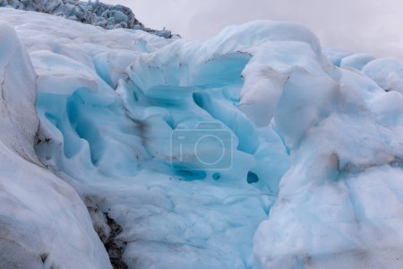 Ice formations in Skaftafell Glacier, part of Vatnajokull National Park, Iceland. Blue glacier ice with cracks and crevasses.