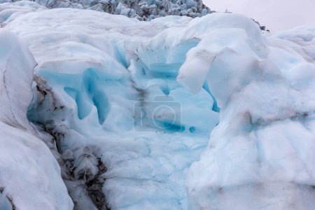 Ice formations in Skaftafell Glacier, part of Vatnajokull National Park, Iceland. Blue glacier ice with cracks and crevasses.