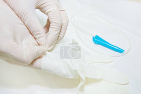 Photo for Hands and remedial catheter. Hygienic care of the patient. - Royalty Free Image