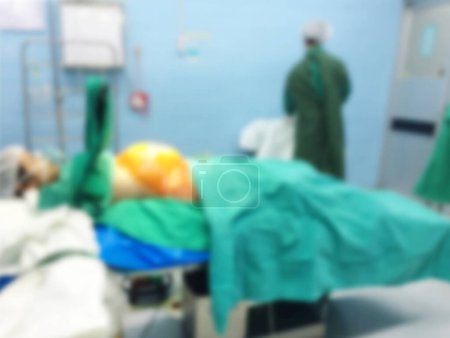 Foto de Motion blur with Medical  performing surgery on a girl cesarean in hospital. Medical  in operating room. - Imagen libre de derechos