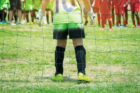 Photo for Goalkeeper stand protecting the ball. - Royalty Free Image