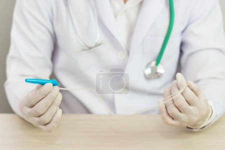 Photo for Hands and remedial catheter. Hygienic care of the patient. - Royalty Free Image
