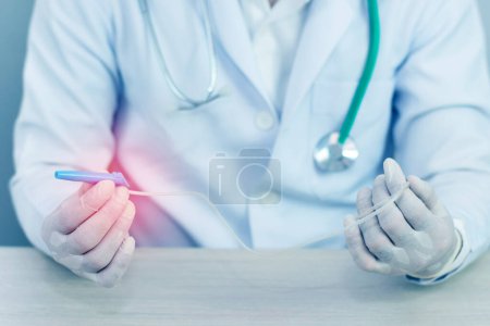 Photo for Bluetone of hands and remedial catheter. Hygienic care of the patient. - Royalty Free Image