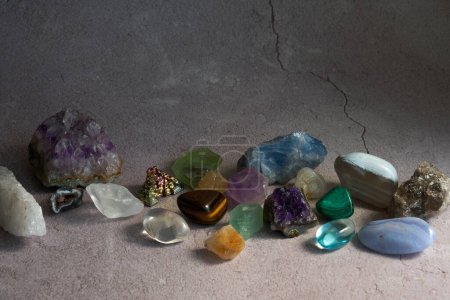 Photo for Various gem stones on a concrete gray background - Royalty Free Image