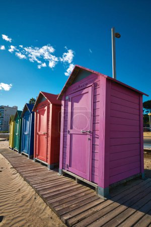 Brightly painted summer beach change rooms at the beach