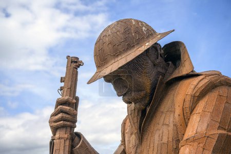 Photo for Steel WW1 solder war memorial at Seaham, County Durham, UK. Made in2014 by Ray Lonsdale is called 1101 (after the Armistice which went into effect at 11am on November 11, 1918) but known locally as Tommy. - Royalty Free Image