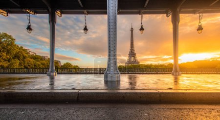  Eiffel Tower and Bir Hakeim Bridge in Paris, France during sunrise.