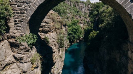 Ancient arch bridge over the Koprucay river gorge in Koprulu national Park in Turkey. . High quality photo