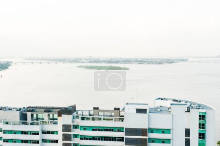 High view of the city of Guayaquil and it's river, at sunset