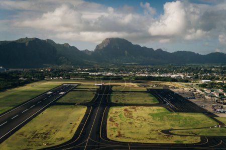Aerial view of the runway and plane hangars of Lihue airport on Kauai island, Hawaii, United States - sep 2022. High quality photo