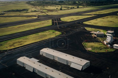 Aerial view of the runway and plane hangars of Lihue airport on Kauai island, Hawaii, United States - sep 2022. High quality photo