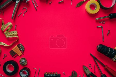 Photo for Construction tools on a pink background. High quality photo - Royalty Free Image