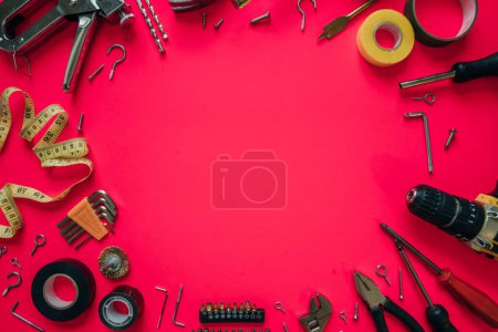 Photo for Construction tools on a pink background. High quality photo - Royalty Free Image