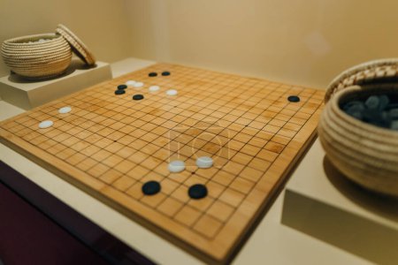 Desk for board game Go and black and white bones. Go or wei-Chi - traditional asian board game. High quality photo