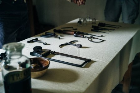 medieval medical tools, detail of vintage surgeon tools on a table. High quality photo