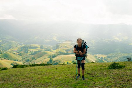 girl Hiker on countryside landscape in the Pyrenees, Pyrenees in France. High quality photo