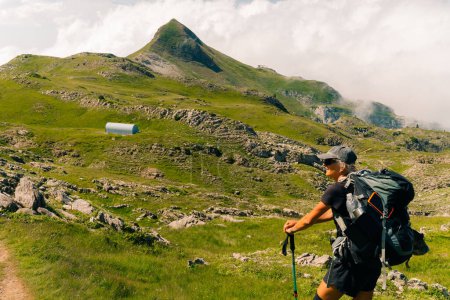 girl Hiker on countryside landscape in the Pyrenees, Pyrenees in France. High quality photo