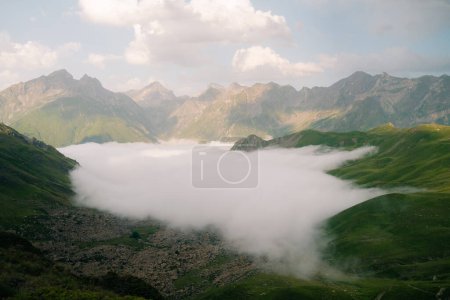 Pombie refuge with people under the Midi d'Ossau. Pyrenees National Park. High quality photo