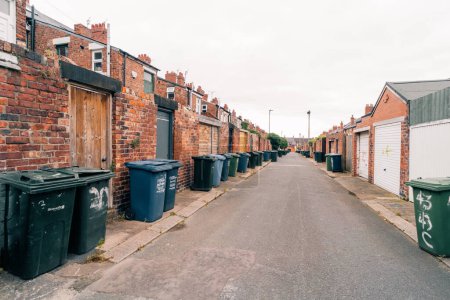 Photo for Wheelie bins outside the front doors in the suburbs of London, uk - may 2th 2023. High quality photo - Royalty Free Image
