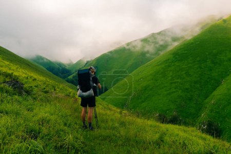 Hiker on countryside landscape in the Pyrenees, Pyrenees in France. High quality photo