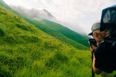 Hiker on countryside landscape in the Pyrenees, Pyrenees in France. High quality photo