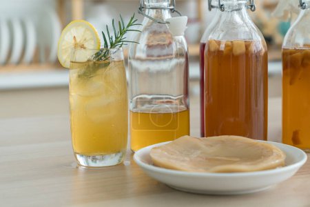 Kombucha superfood probiotic beverage in glass. Natural kombucha fermented tea beverage healthy organic drink in glass.