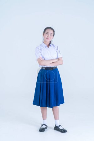 Photo for Back to school. Thai students. The girl is smiling and standing with her arms crossed. - Royalty Free Image