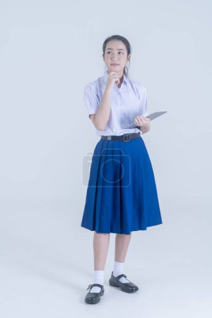 Photo for Thai students. High school asian teenage girls. Student holding her books. - Royalty Free Image