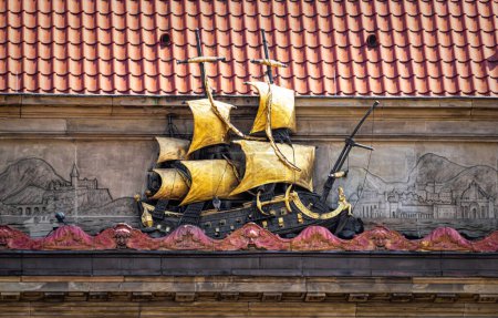Beautiful wall stucco decorations with vintage ship on the wall in Gdansk