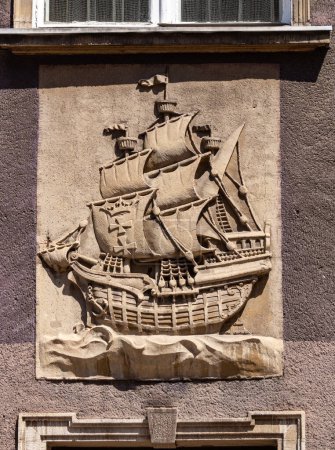 Beautiful wall stucco decorations with vintage ship on the wall in Gdansk