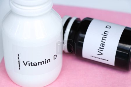 Photo for Vitamin D pills in a bottle, food supplement for health or used to treat disease - Royalty Free Image