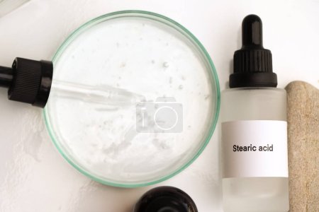 Photo for Stearic acid in a bottle, chemical ingredient in beauty product, skin care products - Royalty Free Image