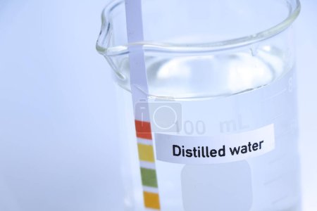 Photo for Distilled water in bottle ,sample pH water in the laboratory and industry - Royalty Free Image