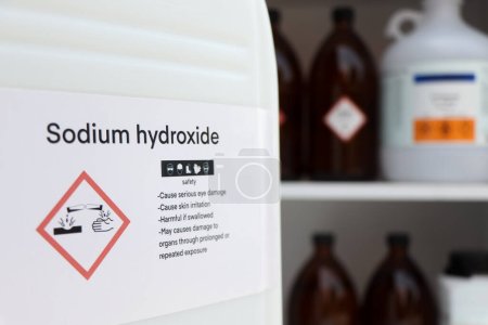 Photo for Sodium hydroxide, Hazardous chemicals and symbols on containers, chemical in industry or laboratory - Royalty Free Image