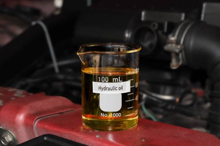 hydraulic oil in container, science experiment concept, oil for industrial use