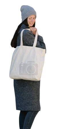 Photo for Woman holding white textile tote eco bag onwhite background - Royalty Free Image