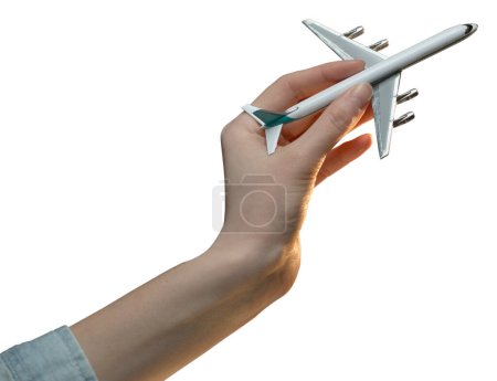 Téléchargez les photos : Femme main tenant un avion jouet isolé sur fond blanc - en image libre de droit