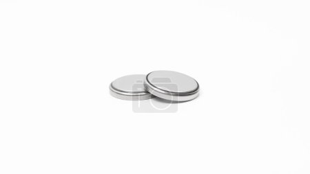 Pair of button cell CR2032 Lithium batteries on a white background, close up.