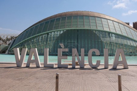 Photo for City Name Valencia written in big letters in front of Hemisferic Cinema Building in Valencia, Spain. - Royalty Free Image