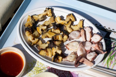 Boiled octopus and conch on a plate