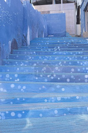 Blue wall with stairs texture background. Sea image coloring