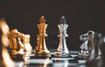 King golden chess and King silver chess standing face to face of the chess both teams . concepts of leadership and business strategy management and leadership