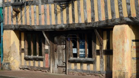 Photo for Ross On Wye, Herefordshire, England Sept 24 2023: 23 Brookend Street, a Grade II listed, historic Tudor style timber framed house dwelling probably built in mid 1500's. It is now on the market. - Royalty Free Image