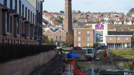 Photo for Barry, Vale of Glamorgan, Wales Feb 1 2024: Work on dockland regeneration continues. The areas around the old pumphouse and railway buidings have already been developed into social and working spaces. - Royalty Free Image