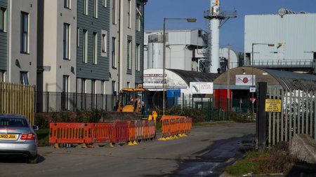 Photo for Barry, Vale of Glam, Wales Feb 02 2024: East Quay, The Waterfront. New site being landscaped. Homes are very close to the perimeter of industrial dockland and controversial bio chemical incinerator. - Royalty Free Image