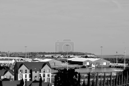 Barry, Vale of Glam, Wales Feb 02 2024: Looking down over the waterfront from Barry Island.New build homes and apartments built on disused dock land have transformed the site from industrial to urban. mug #700627136
