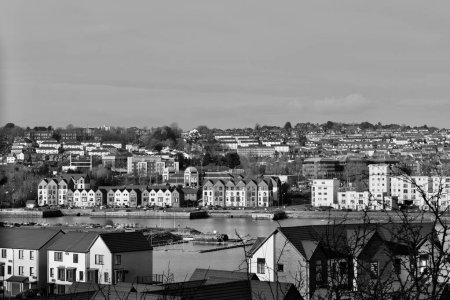 Barry, Vale of Glam, Wales Feb 02 2024: Looking down over the waterfront from Barry Island.New build homes and apartments built on disused dock land have transformed the site from industrial to urban. magic mug #700627156