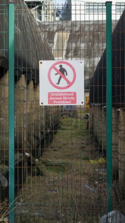 Photo for Barry, Vale of Glam, Wales 02 Feb 2024: Hazards on Industrial site on dockland including discarded materials from house clearance and refurbishment as well as dangers in and around the buildings. - Royalty Free Image