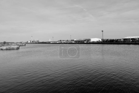 Photo for Barry, Vale of Glam, Wales 02 Feb 2024: The eastern limits of Barry dockland is the active port retaining its traditional industrial landscape. The 160 acre Dow Corning site stretches beyond it. - Royalty Free Image