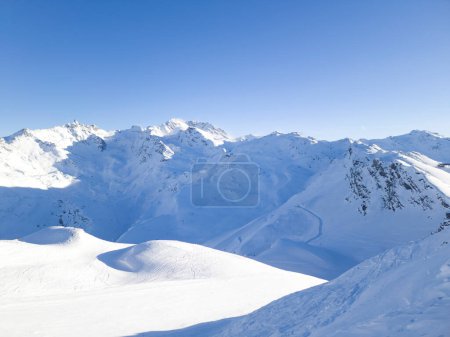 Photo for Panoramic view of French alpine rugged peaks covered with snow, with ski slopes . - Royalty Free Image
